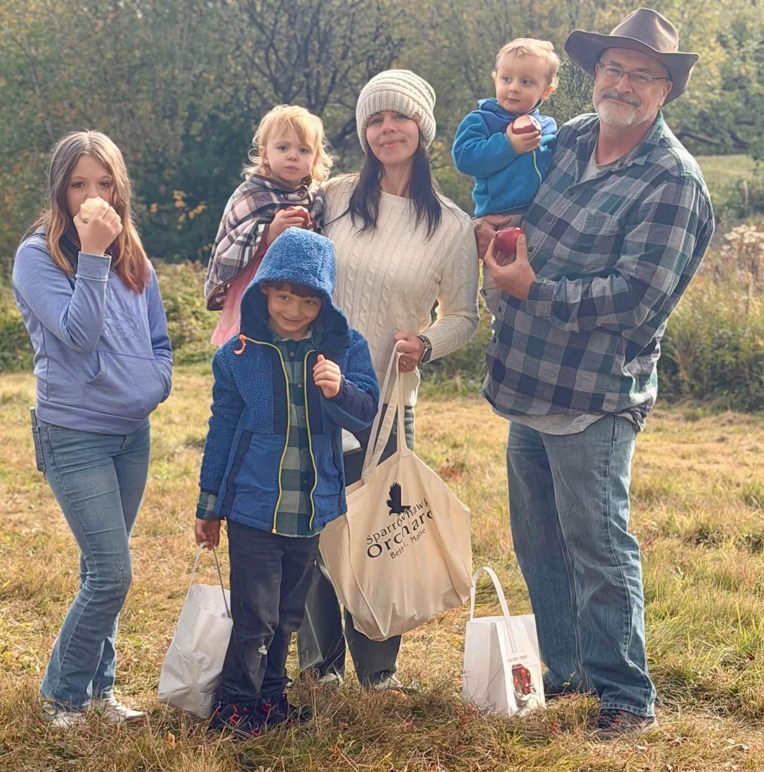 Legacy Acres family gathering outdoors together in the North Country
