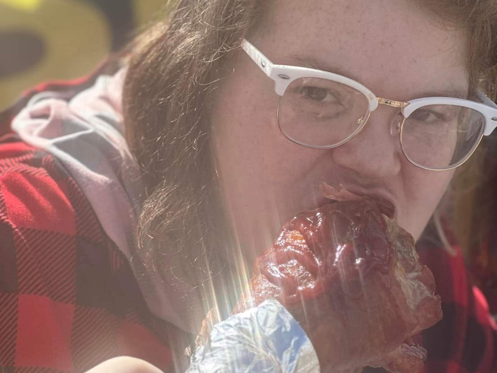 Kendra, official food tester, sampling a smoked turkey leg